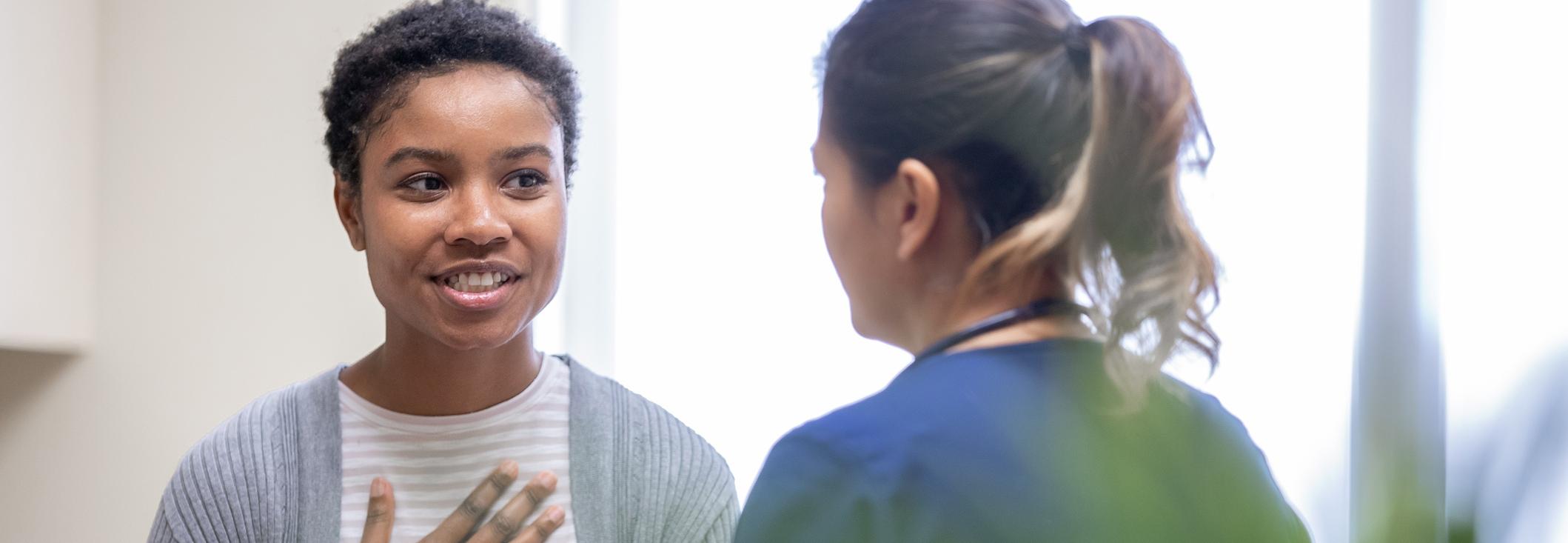 Patient and health care worker talking